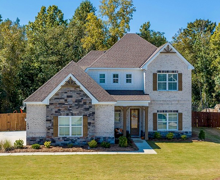 front view of home with nice lawn in the front yard